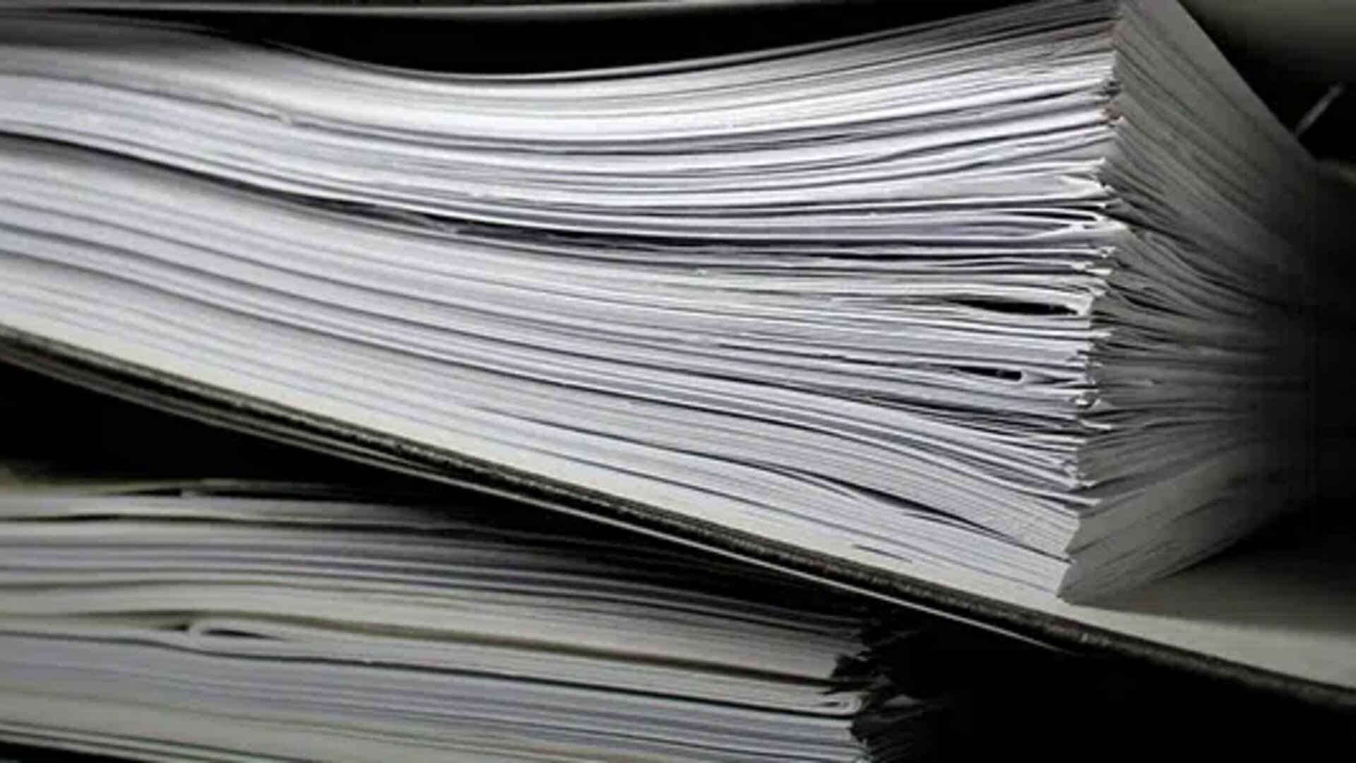 Close-up of thick paper folders filled with documents