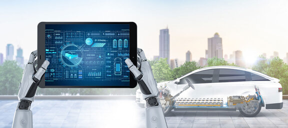 © iStockphoto/PhonlamaiPhoto tablet in hands of robot with the car in the backround